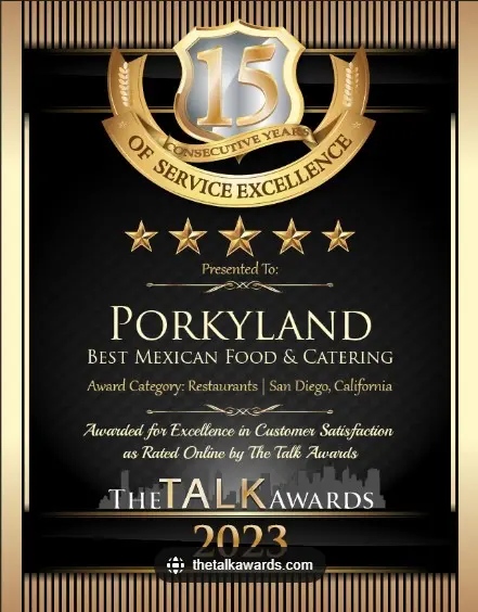 Award plaque with a gold emblem for 15 years of service excellence, displaying five stars. Recognizing Porkyland for best Mexican food and catering in San Diego, 2023.